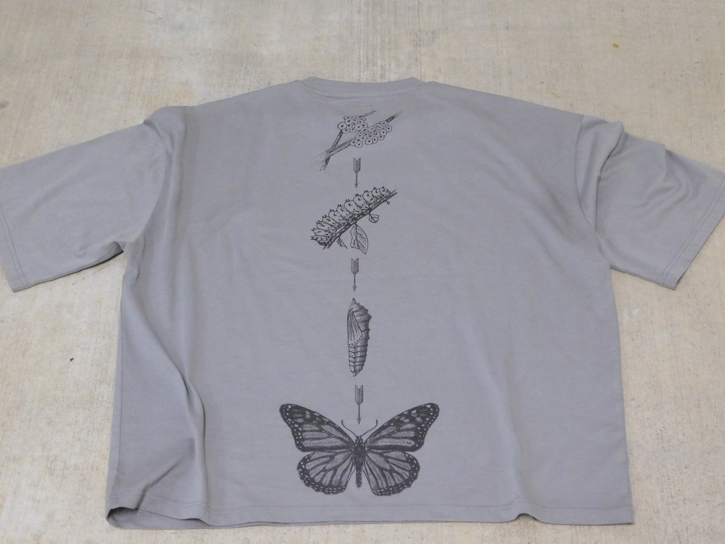 Metamorphasis in motion tee